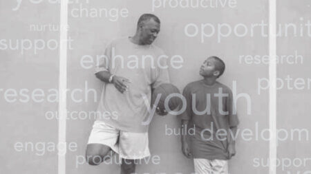 man and boy with a basketball