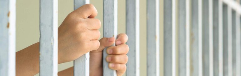 child behind bars
